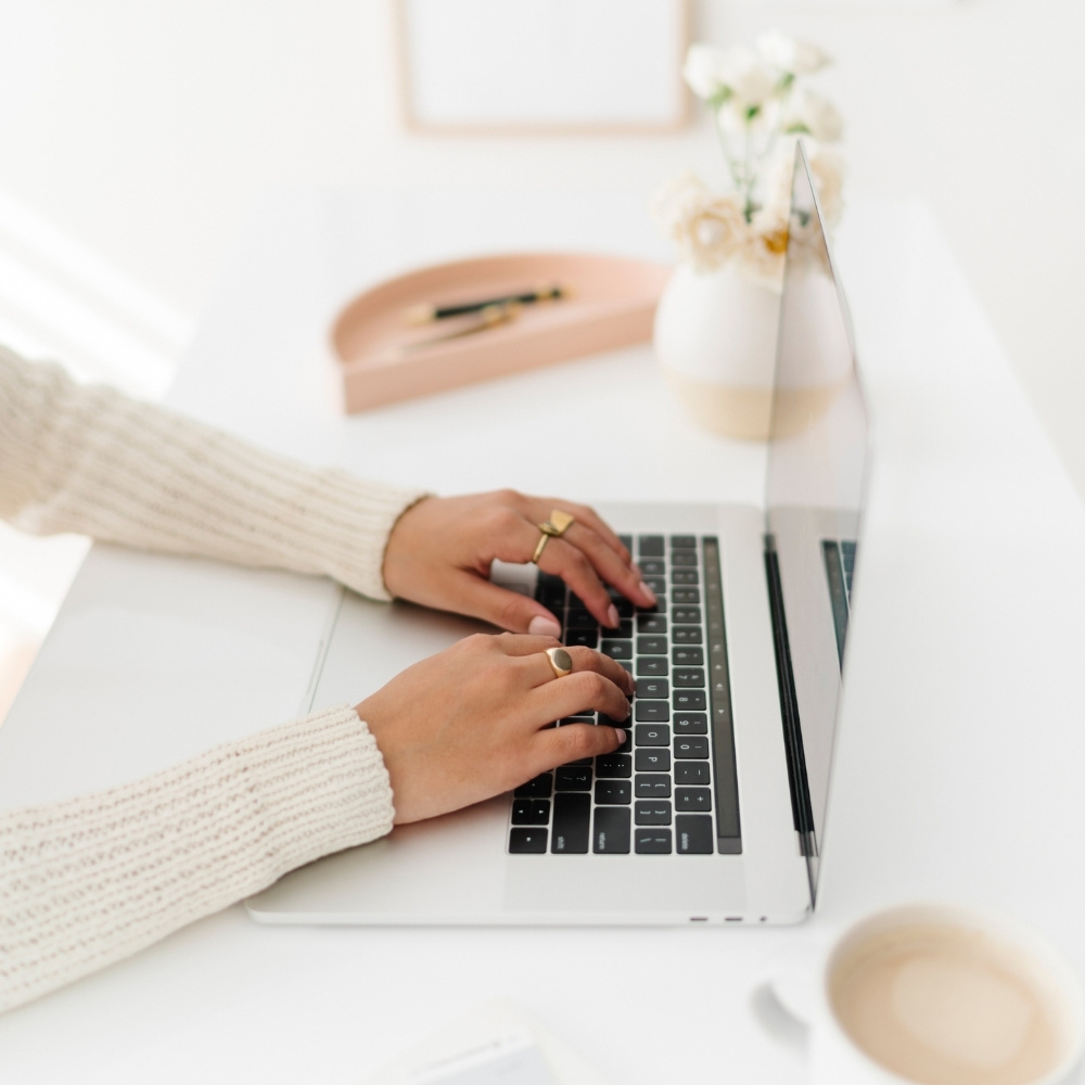 30 canva keyboard shortcuts 1 female blogger typing on laptop