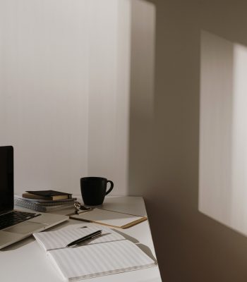 home office laptop on white desk