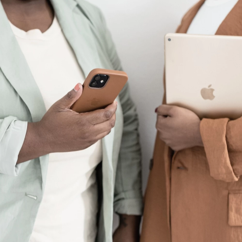 two female entrepreneurs with phone and iPad