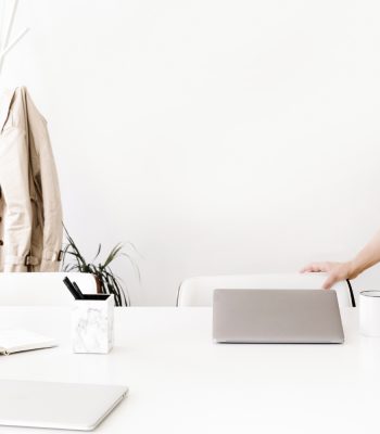 lady pulling out chair in come office