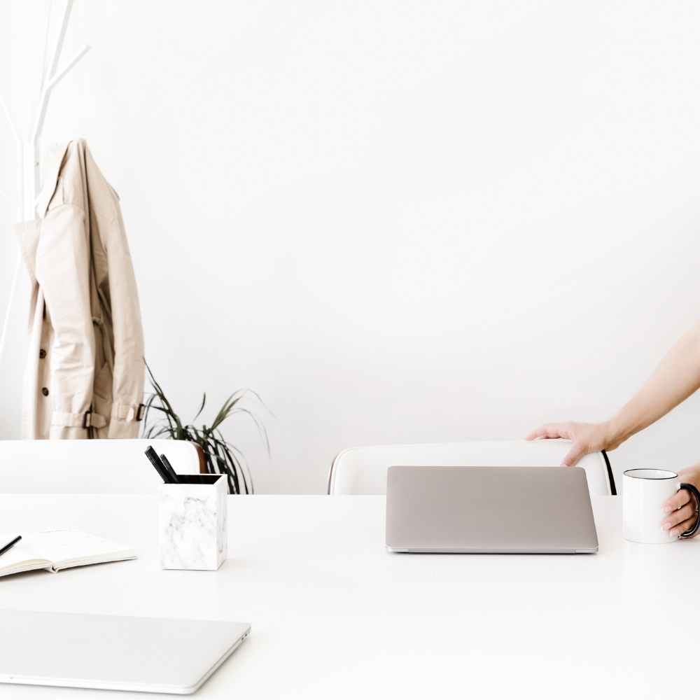 lady pulling out chair in come office