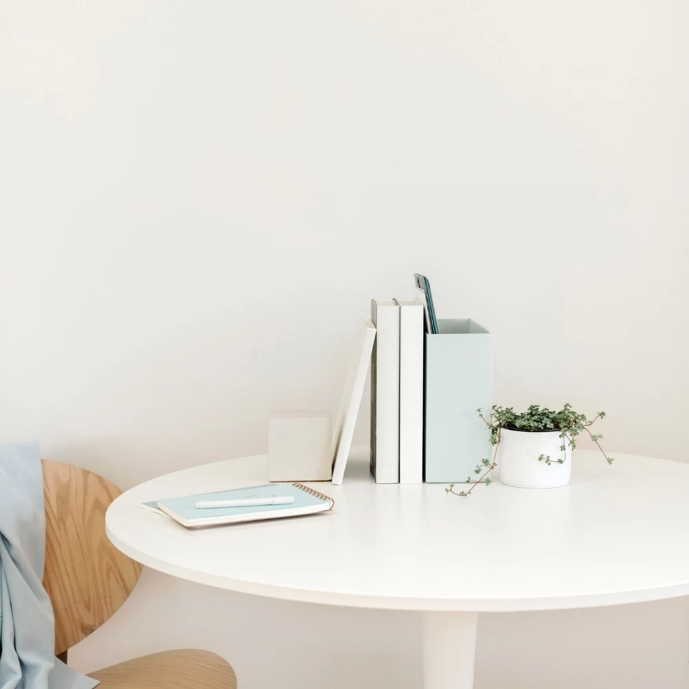 desk with blue notepad