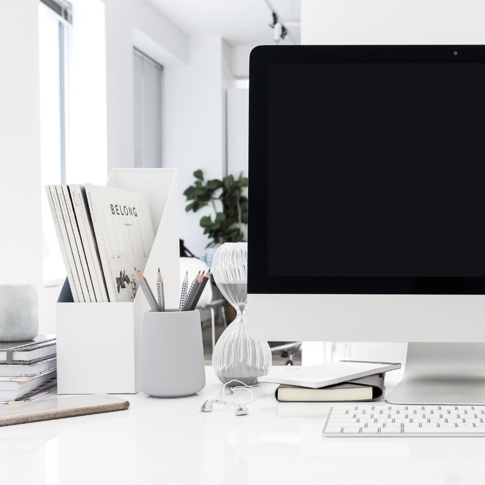 How to Easily Create a Custom Email Signature in Canva 3 iMac on white desk with office accessories