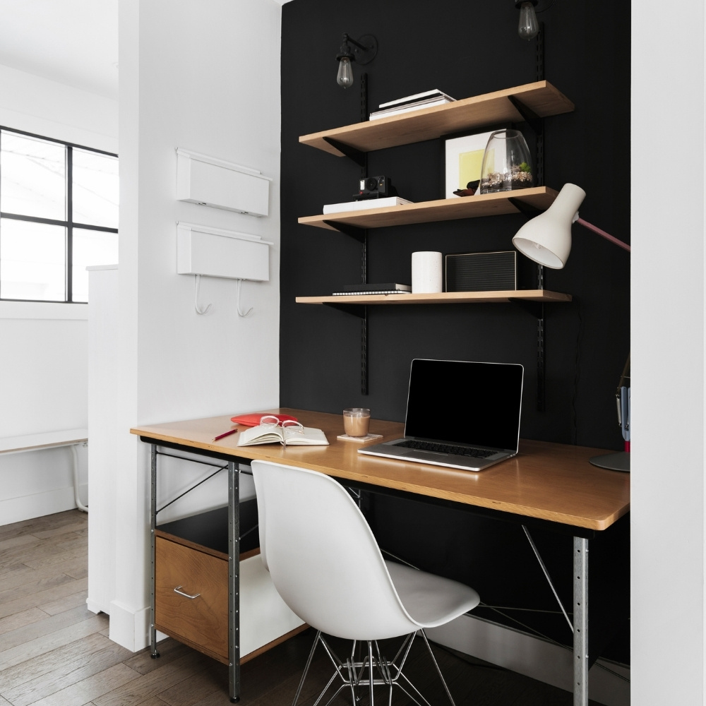 home office laptop on wooden desk and white chair