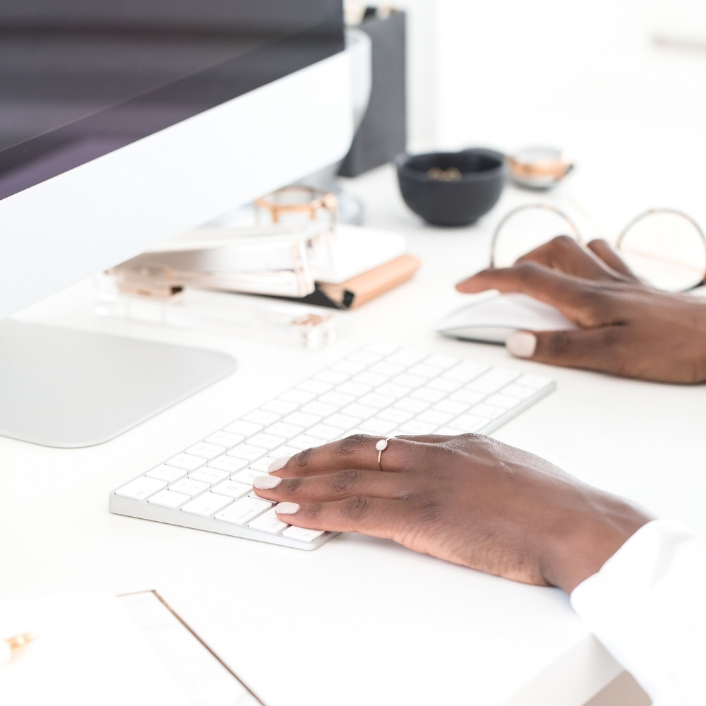 blogger typing on keyboard