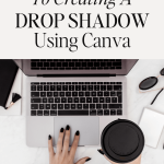 woman holding coffee typing on laptop