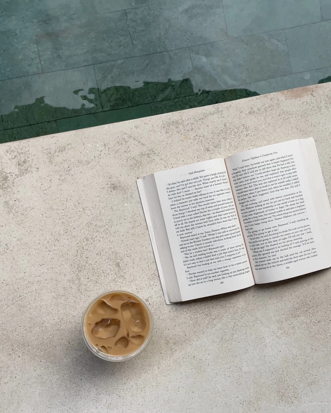 ice coffee and book at the pool ice coffee and book at the pool