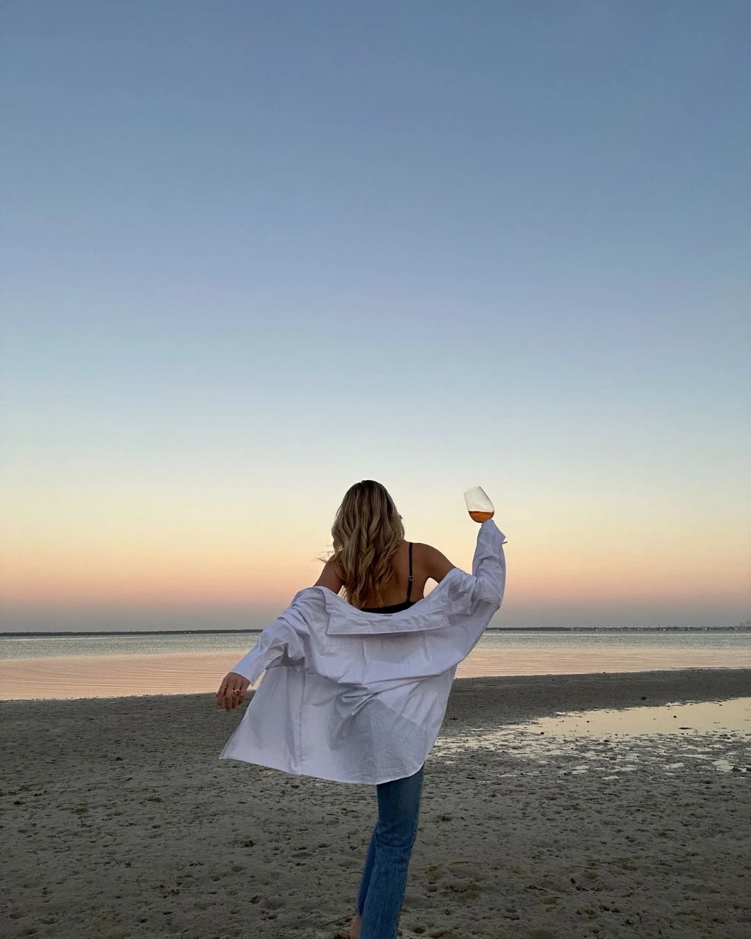 black and white image of girl wearing pearl earrings